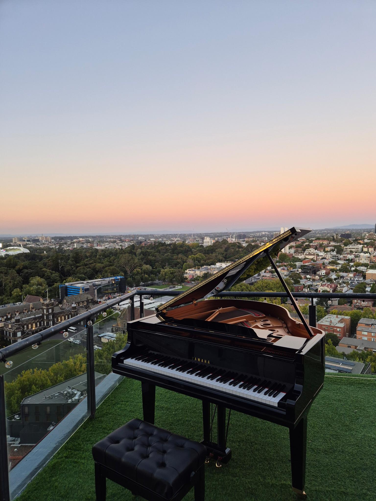 Grand piano on a Melbourne rooftop at sunset